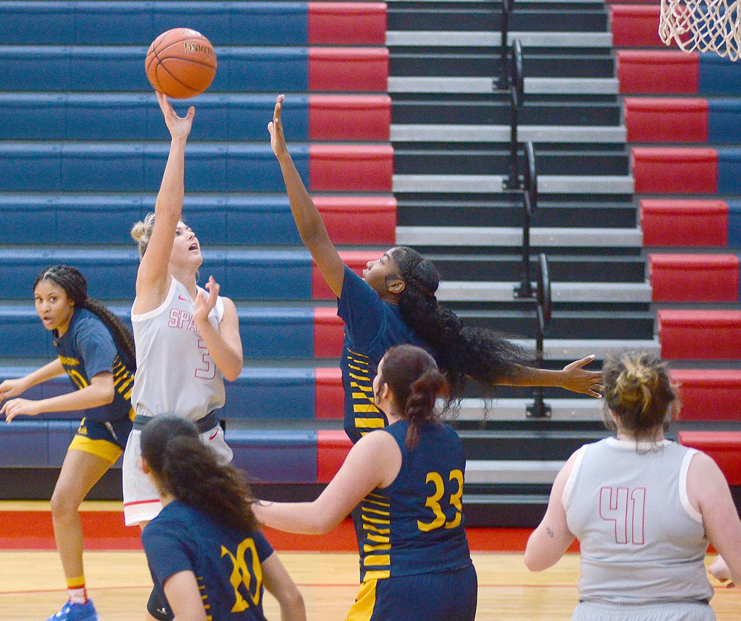 Southwestern guard Cassidy Nelson releases a shot in the lane over a Marshalltown defender Saturday. Nelson scored a game-high 19 points in the 64-46 win.