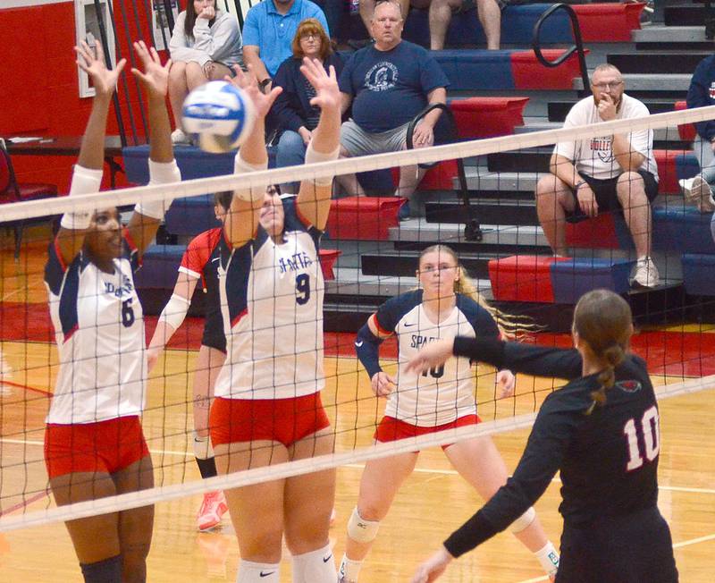 Southwestern's Skyelar Lawal (6) and Addison Martin (9) attempt to block the attack of Northeast's Alli Brown (10) during Wednesday's match. Maddie Richter (10) is at right.