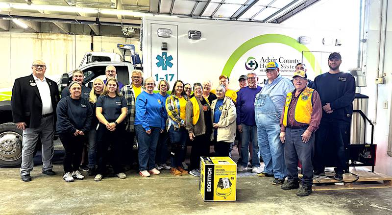 Adair County Ambulance personnel are presented with equipment that replaces equipment lost in the tornado. The Lions Club organization obtained a grant to pay for the equipment.