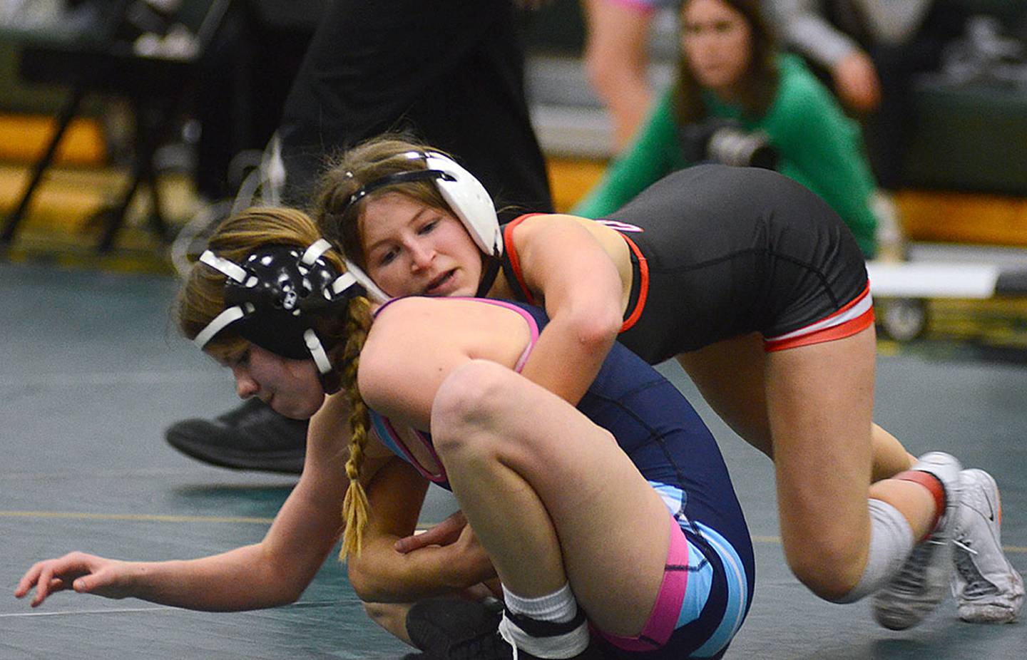 Creston's Eva Chesnut (top) stays in control against Natalie Waltz of Panorama on the way to placing second at 105 pounds.