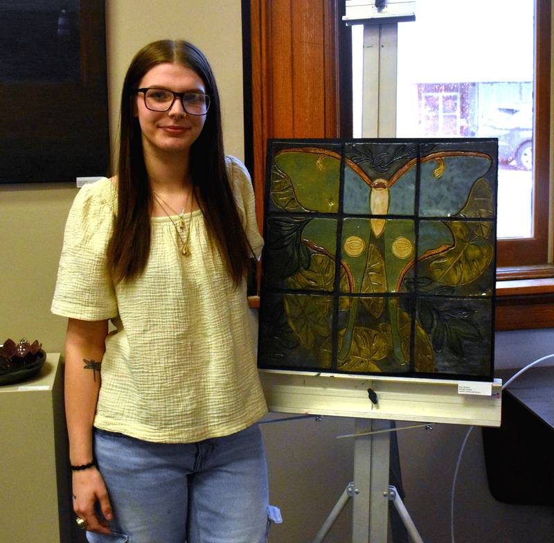 Creston senior Mica Williams poses with her favorite piece, Midnight C?