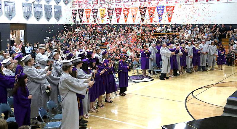 Nodaway Valley High School graduates release confetti cannons at the end of Sunday's commencement exercises.