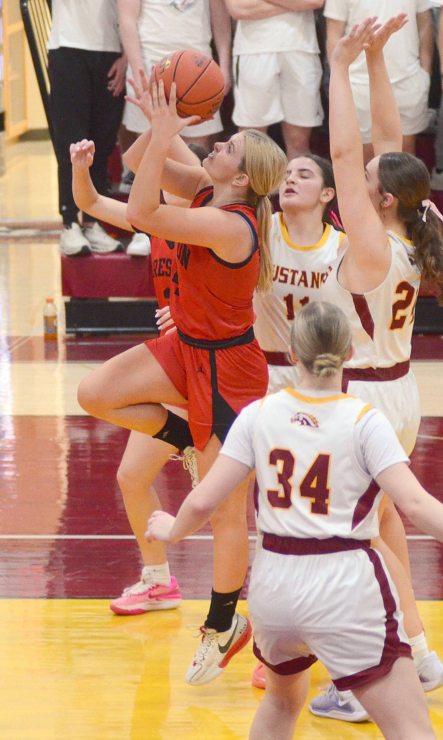 Ella Turner of Creston shoots in the lane against Prairie City-Monroe. Turner scored four points in her final game.