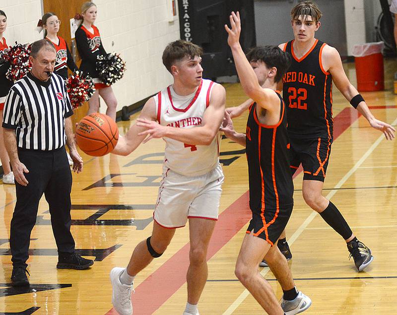 Creston's Cael Barton looks for an open teammate during Monday's game against Red Oak.