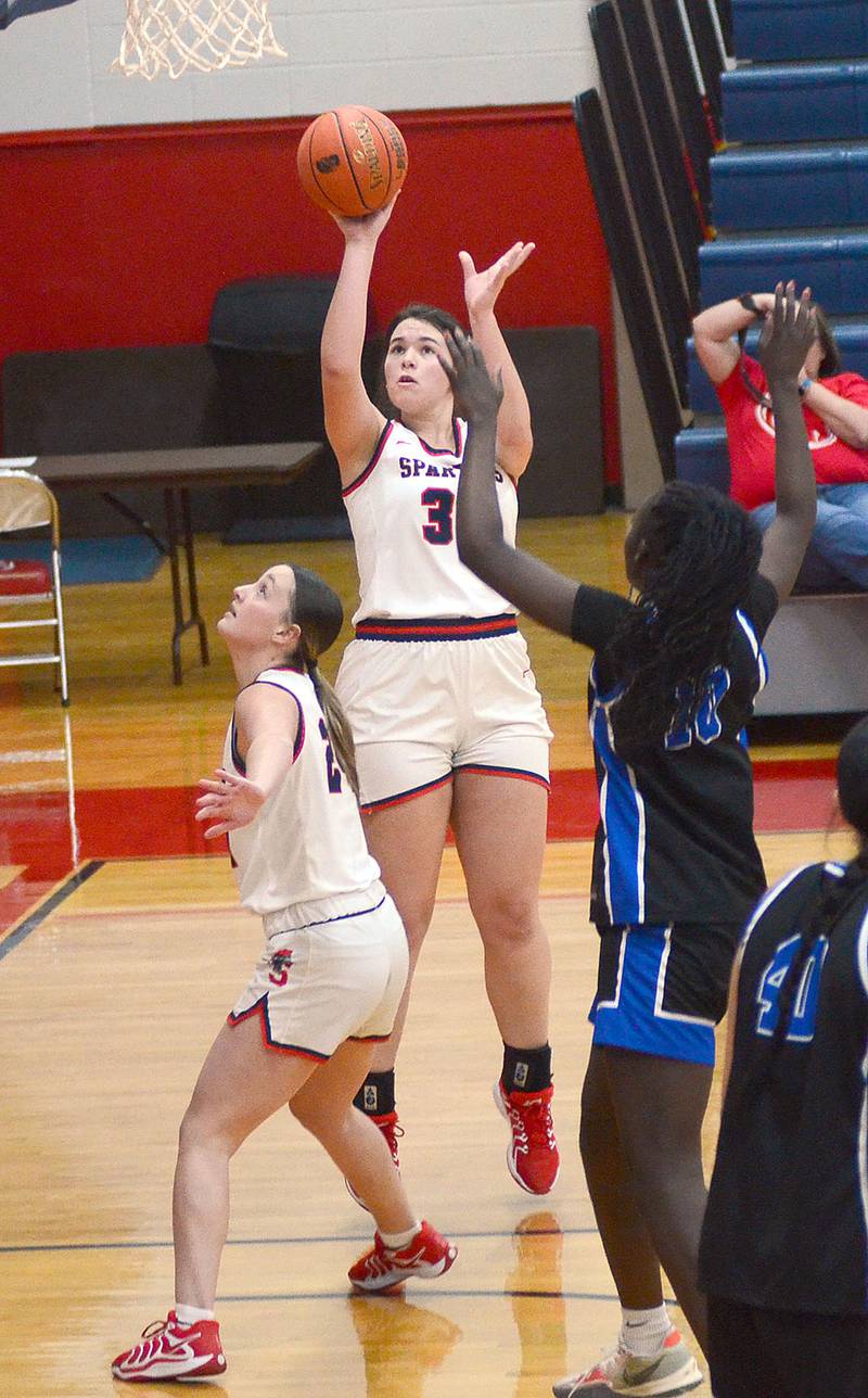Southwestern freshman Dalanie Affert shoots from short range as teammate Brooklyn Hadl gains rebounding position. Auffert had points and three rebounds.