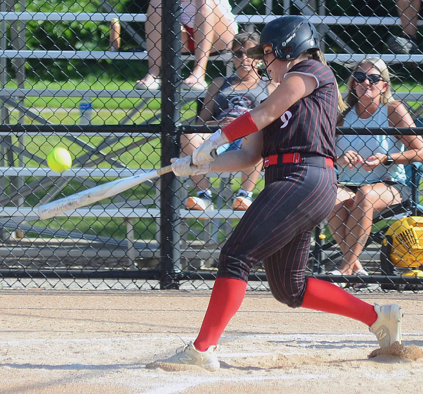 Jaycee Hanson connects for a three-run home run in game one Thursday against Clarinda. Hanson hit her sixth and seventh home runs of the season in the doubleheader sweep.