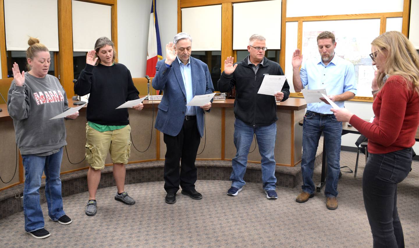 The winners from the city council and special mayoral elections are sworn in Tuesday, Dec. 16 before the city council meeting. All council positions begin in January, while the mayor began his duties that day. From left, Ward 1 Representative Jocelyn Blazek, Ward 3 Representative Jen Worisek, Mayor Doug Daggett, At-Large Representative Toby Henry and Ward 5 Representative Jason Cook, sworn in by City Clerk Brandea Leach.
