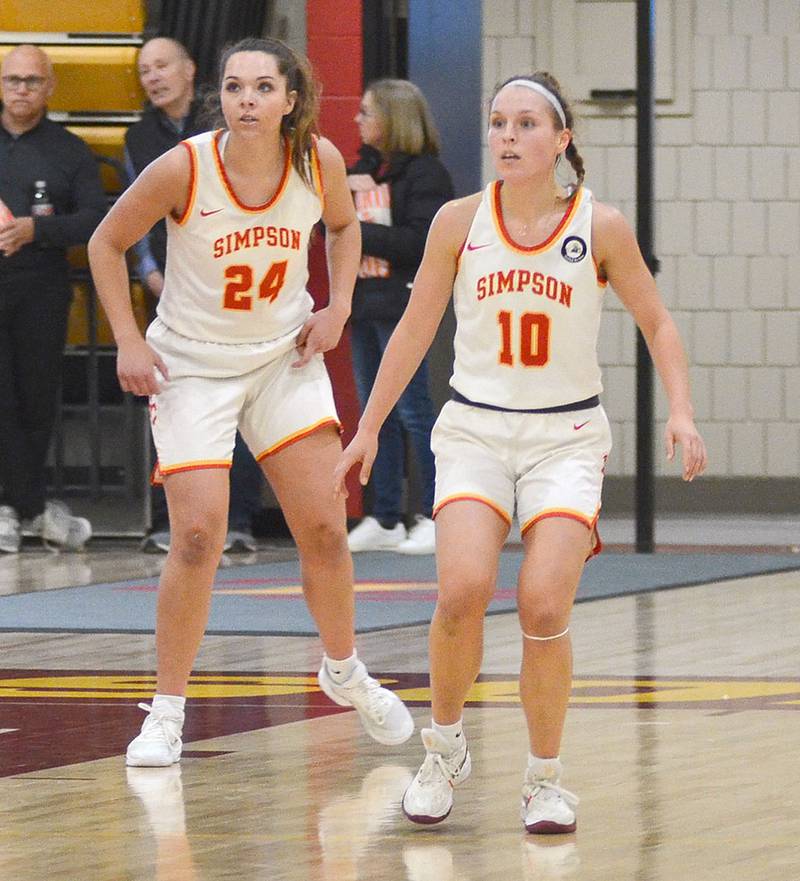Freshman Doryn Paup of Creston (24) and sophomore Maddax DeVault of Nodaway Valley (10) are on the court together during Wednesday's conference victory over Coe College. Both are averaging about 10 minutes a game for the Storm.