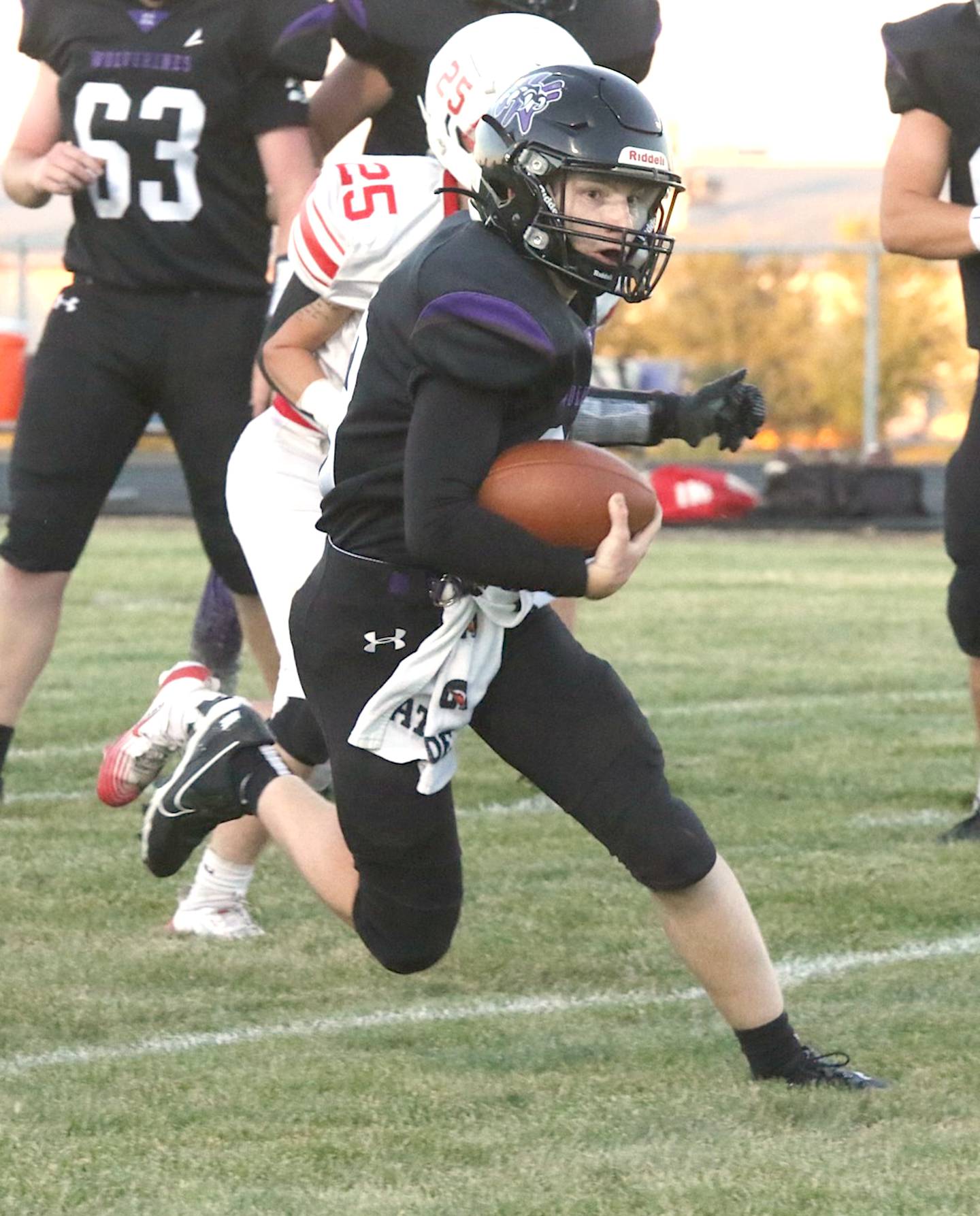 Wolverine senior Titus Hamer chugs up field with green grass in front of him during last week's football game with Central Decatur. Hamer had 29 carries for 153 yards and a touchdown, and he was tackle leader with eight.