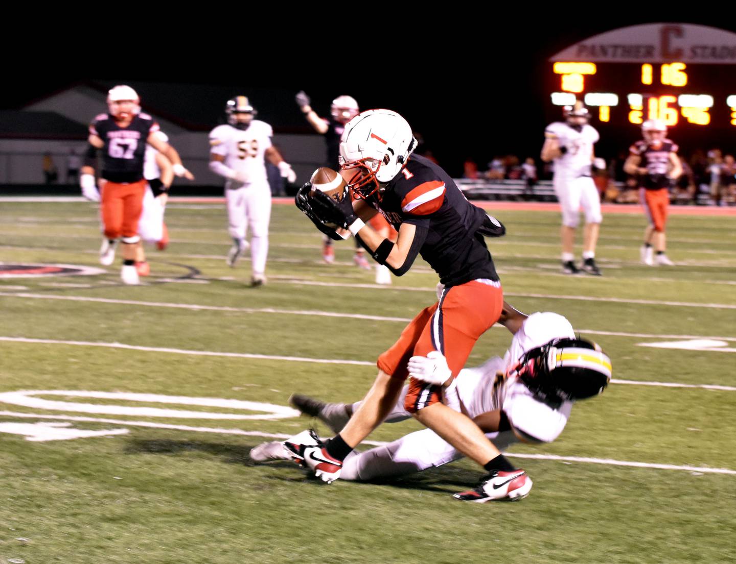 Creston junior Jace Purdum snags a pass from quarterback Tanner Ray. Purdum led Panther receivers with six catches for 77 yards and a touchdown in the 29-27 homecoming loss.