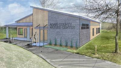 Conservation talks building nature center/office facility