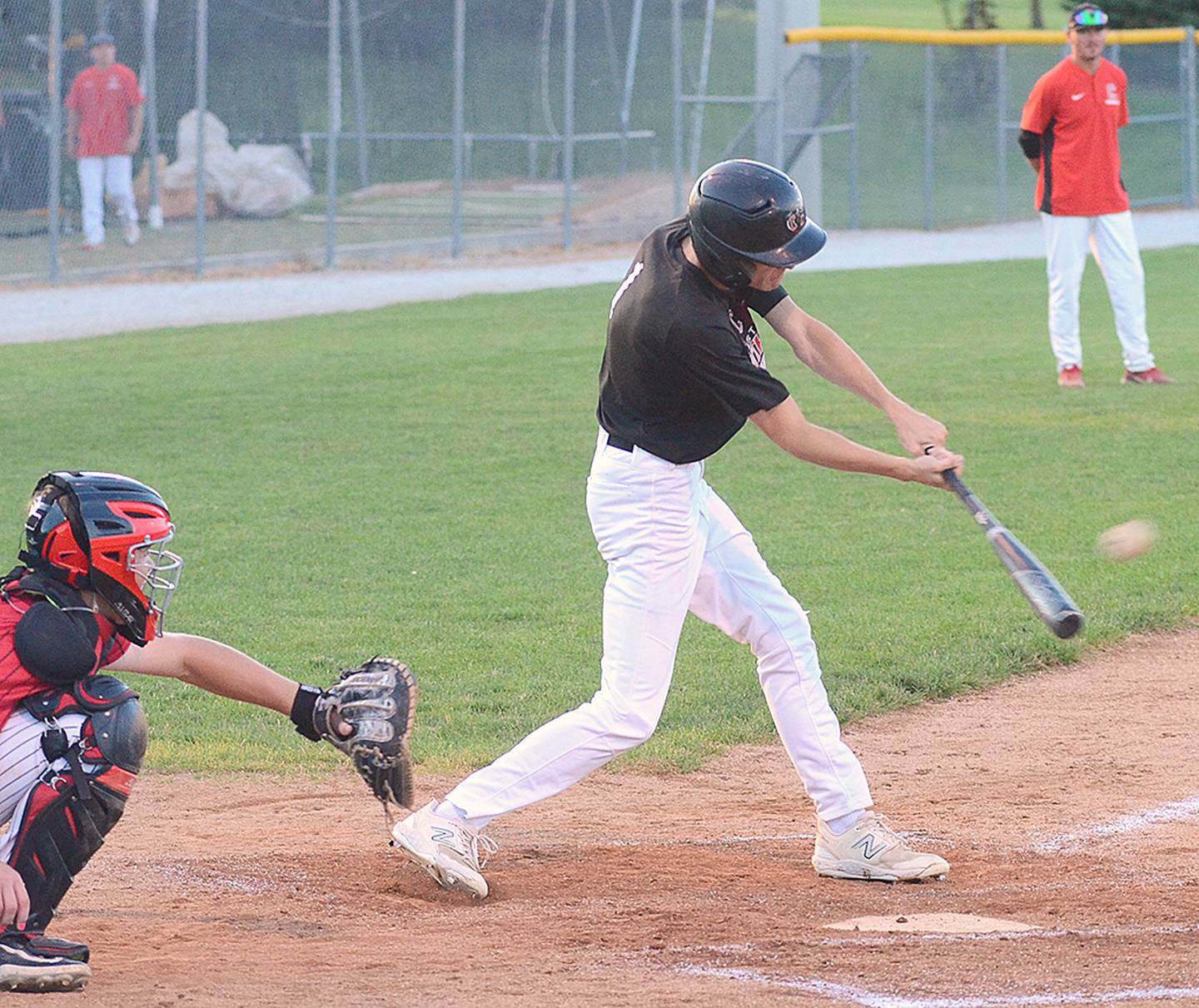 Gavin Millslagle of Creston connects with a pitch against ADM Monday night. The senior left fielder hit a double earlier in the Panthers' 3-2 victory.