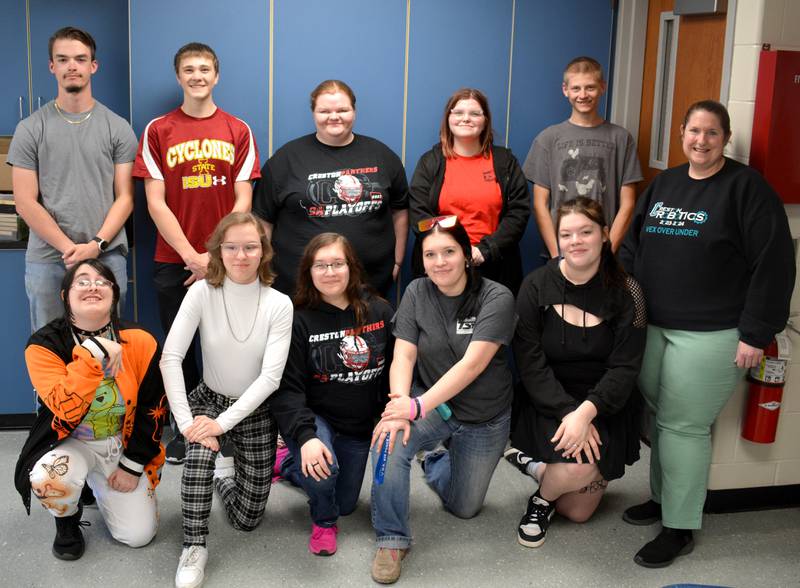 Multiple members of the robotics club, as well as their coach, Heidi Lumbard.
Back, left to right: Kurtis Bradley, Stephen Sistad, Jenna Orr, Nevaeh Kerns-Potter, Jerry DeGonia. Front: Chloe Shatto, Hope Woods, Emily Buchanan, Liz Buchanan, Trinity Kohl, Heidi Lumbard.