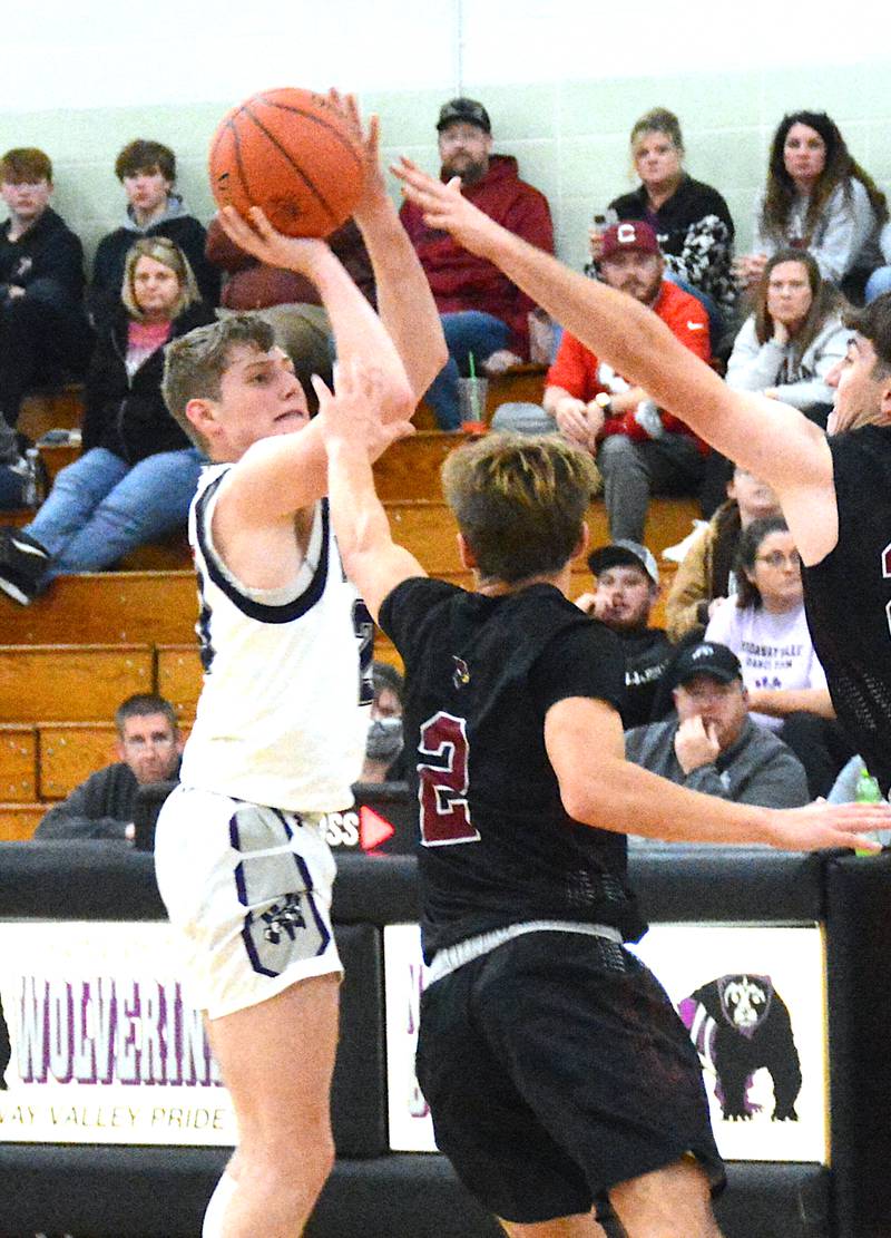 Senior Dawson Nelson shoots a jump shot against a Clarinda defender early in the 2023-24 basketball season.