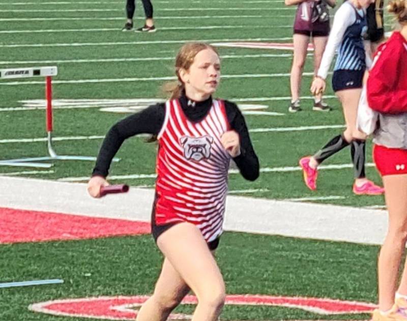 Orient-Macksburg's Mattie Thompson runs the third leg of the distance medley relay in a recent meet.