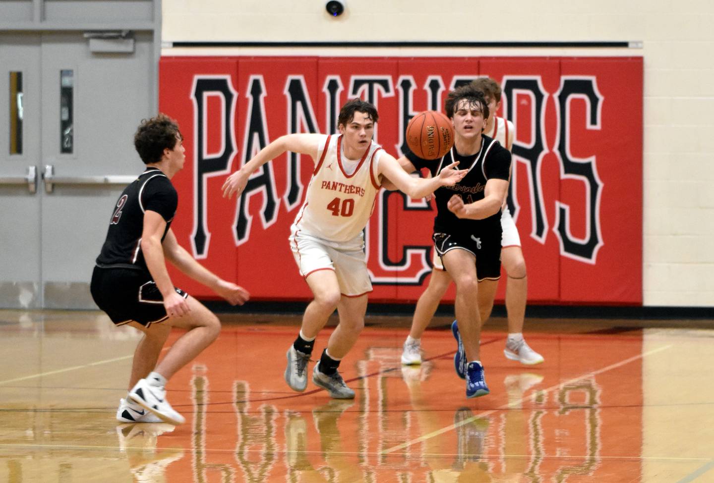 Creston’s Ayden Purdum fights for a rebound in a 44-33 loss to Clarinda.