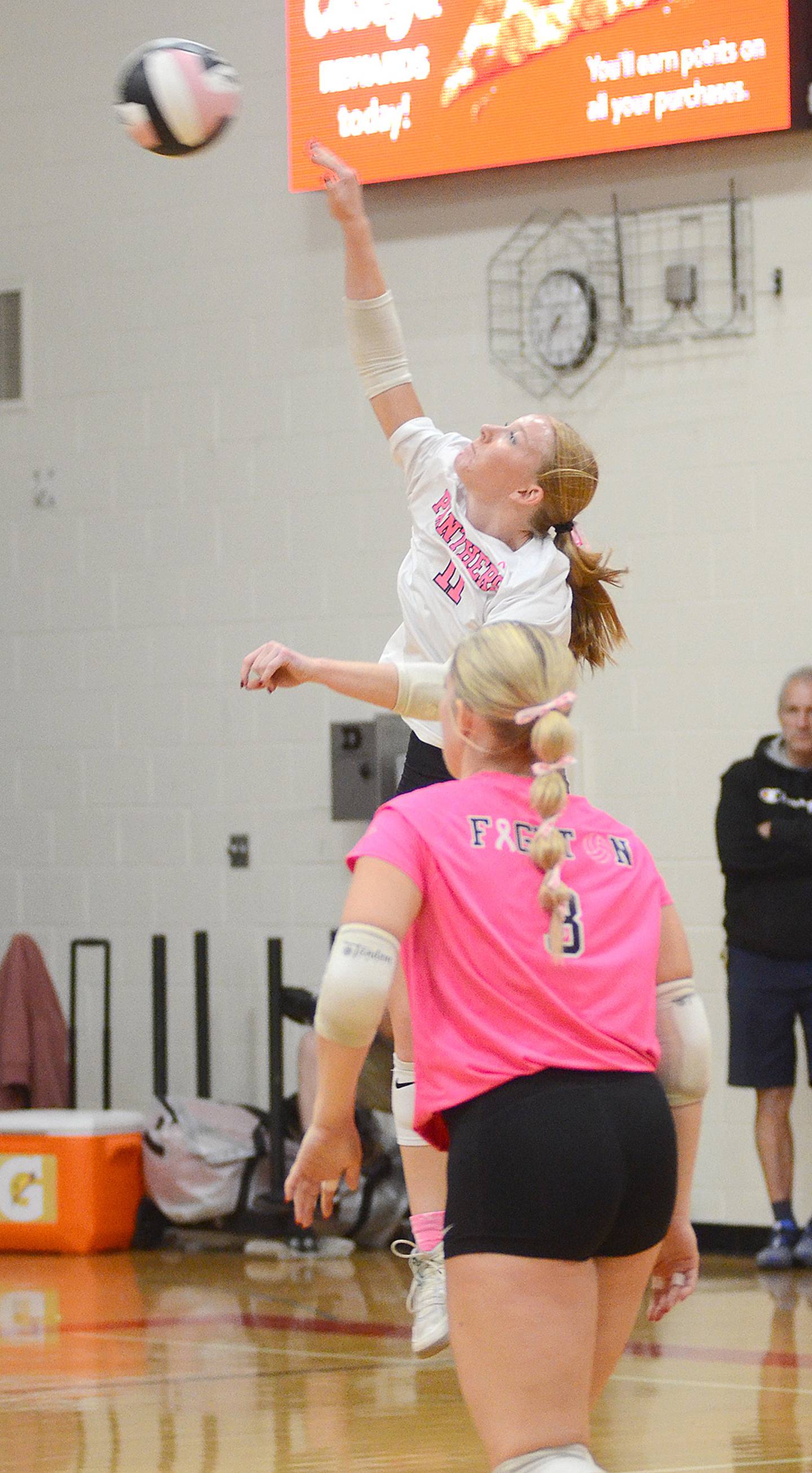 Avery Staver of Creston sends a jump serve to the St. Albert court as Jaycee Hanson (3) looks on. Staver served two successive aces in the 17-15 fifth set win.