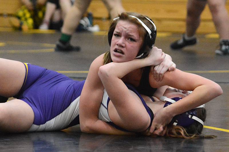 SWAT's Addison Herr wrestles Denison-Schleswig's Addison Ransom Saturday at Atlantic High School.