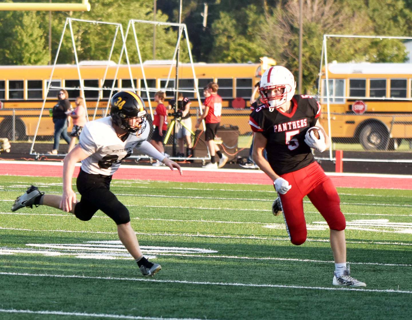 Junior Josh Schaefer goes around a defender after catching a pass from Cael Turner. Schaefer had nine receptions for 88 yards and three touchdowns in the victory.