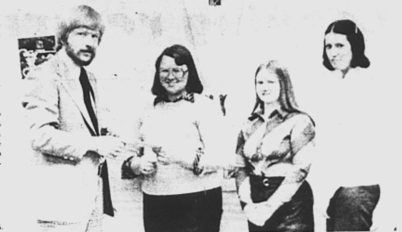 Peter Malmberg, left, special education director for the Green Valley Area Education Agency, accepts a check for $866 from Debbie Scheel, Dianne Dunkerson and Mary Trenkle, officers of the SWCC Office Occupations club. The money was raised by the club’s Rockathon held at SWCC Feb. 16.