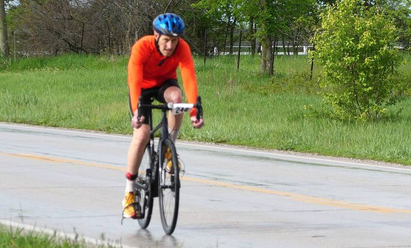 Ytzen bikes down the road during a triathlon, an activity he only recently picked back up.