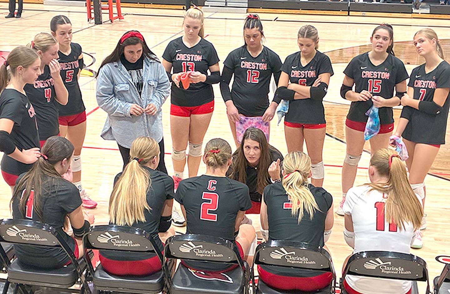 Creston coach Naomi Sharp meets with her team during a break in the action Thursday at Clarinda. Sharp has coached this year's seniors for six years, including offseason AAU tournaments and two years of high school varsity competition.