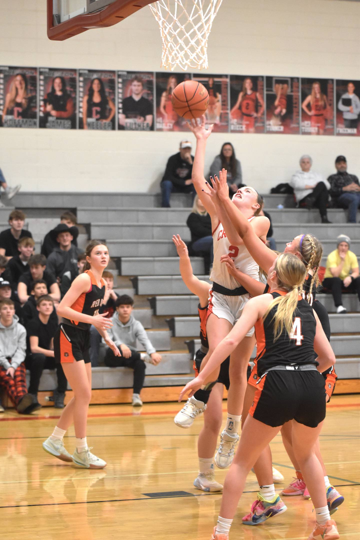 Hollynn Rieck fights through traffic for a layup Monday in a 58-45 win over visiting Red Oak. She posted 14 points in the Panthers' fourth straight win.