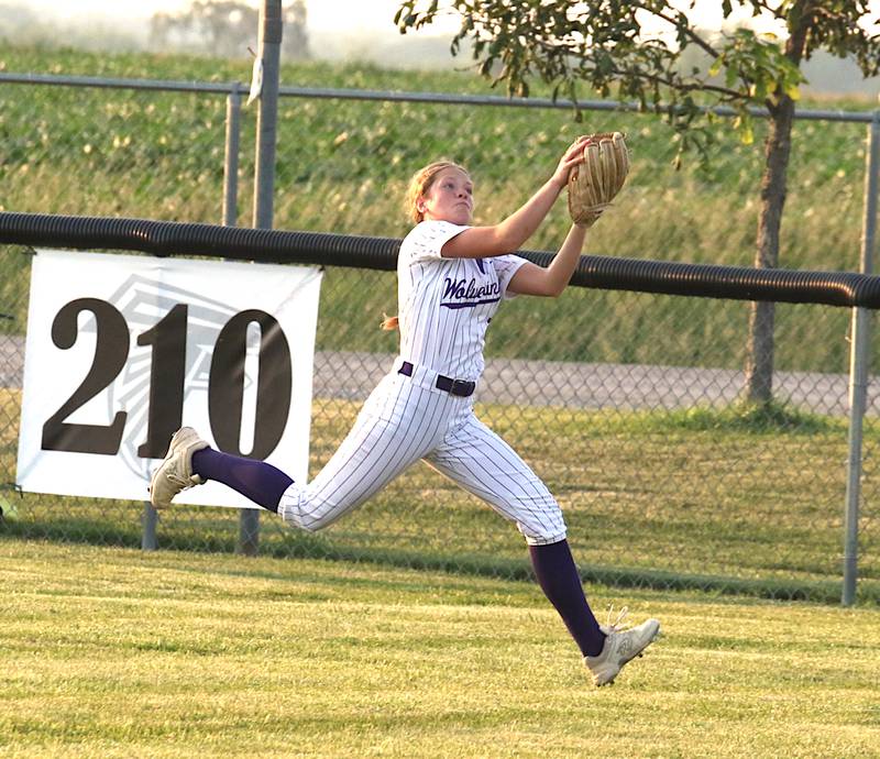 NV/OM's Mattie Thompson tracks down a fly ball in the outfield during a game at Wayne recently.