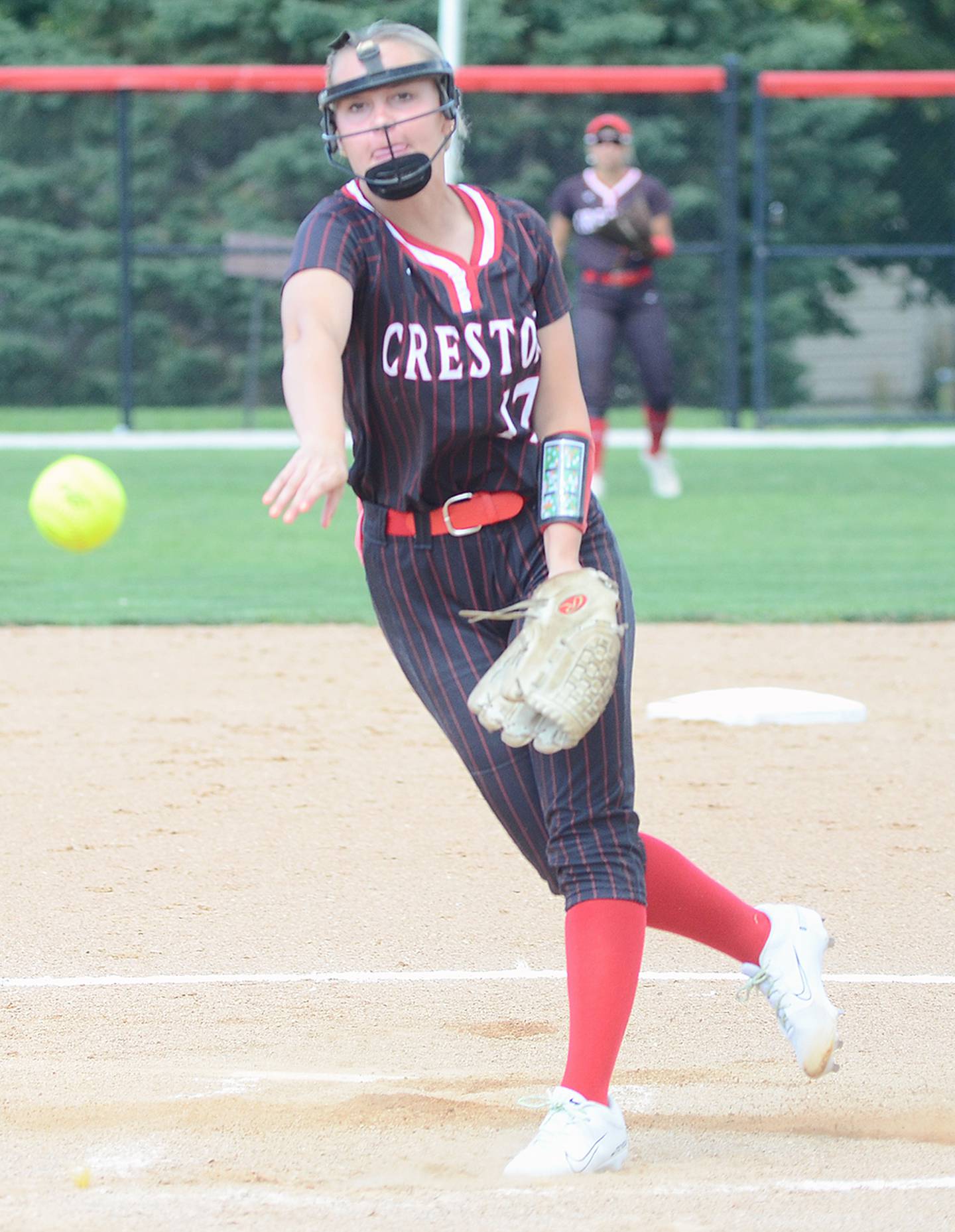 Creston's Taryn Fredrickson sends a pitch to the plate Friday against Denison-Schleswig. The Panther junior totaled 18 strikeouts in two appearances Friday, surpassing 400 career strikeouts.