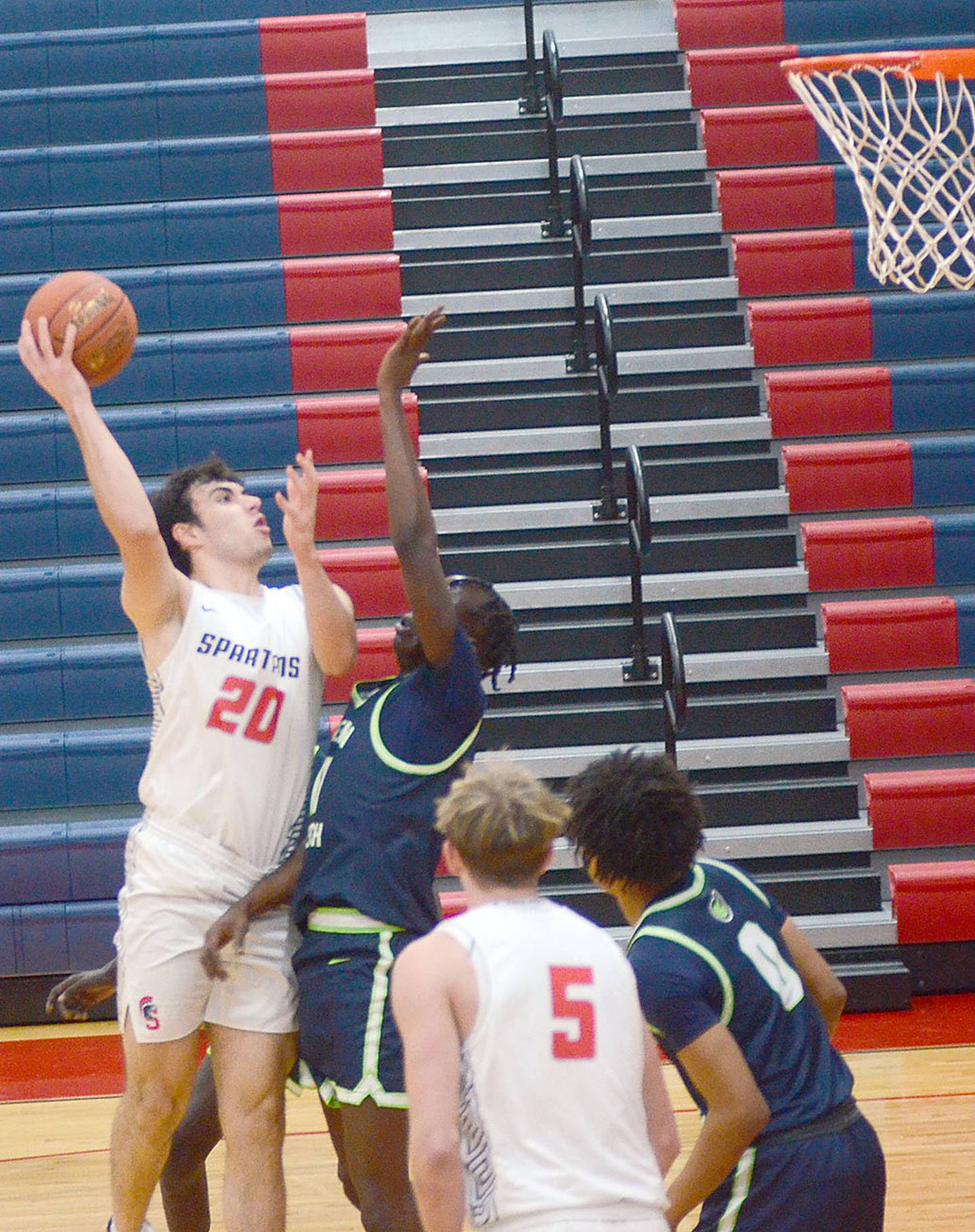 Southwestern center Fatih Huyuk shoots a hook shot in the lane against Western Iowa Tech Wednesday. Huyuk had nine points and three assists in the 75-66 win.