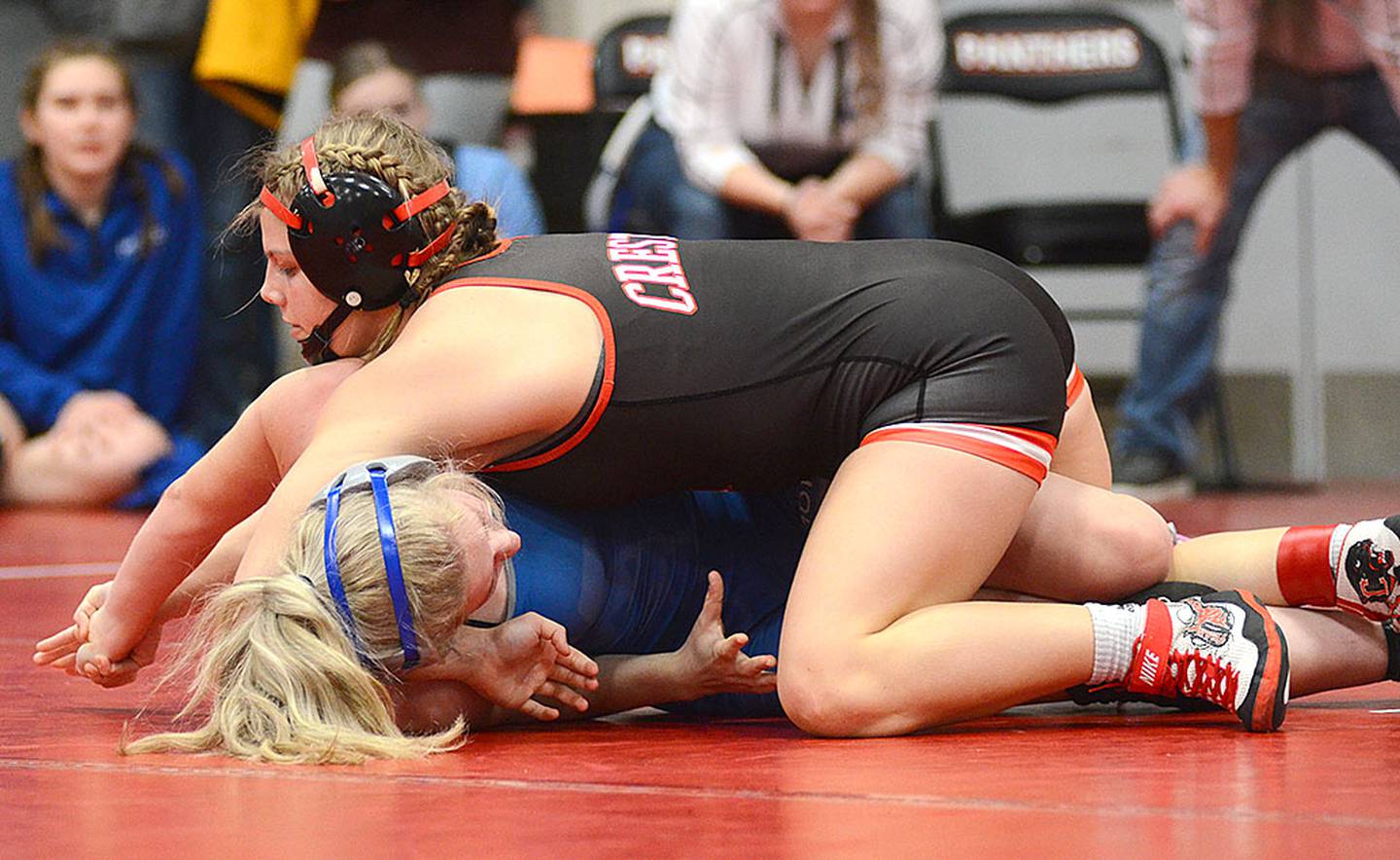 Evy Marlin of Creston works for her third pin in Thursday's tournament on the way to winning the 135-pound division. Marlin won by a technical fall in her fourth match.