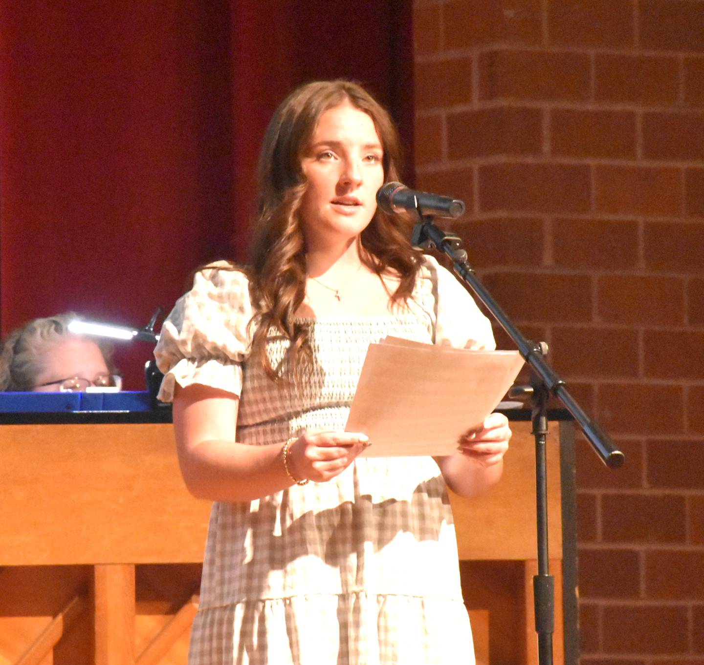 Lilly James sings "Nothing That My Hands Can Do" during the service.