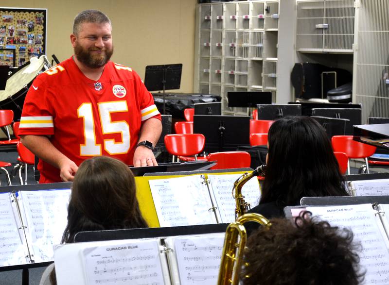 Creston Middle School Band Director Ryan Linke shares a smile with a student while directing the middle school jazz band. Linke is the 2024 recipient of the Young Band Director Award, given by the Southwest Iowa Bandmaster's Association.