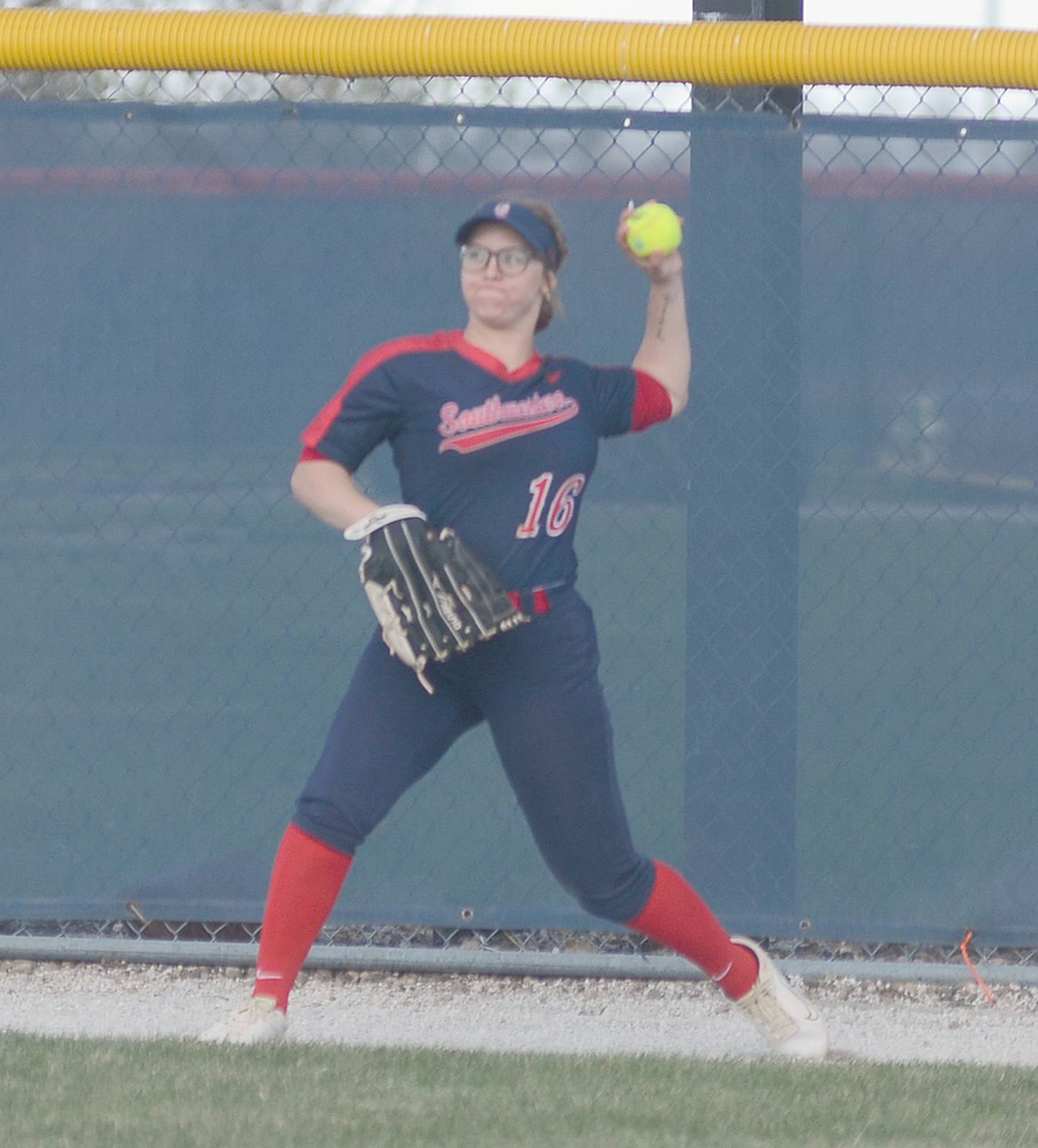 Right fielder Jayliegh Robins throws to the infield after a North Central Missouri double to the warning track Thursday.