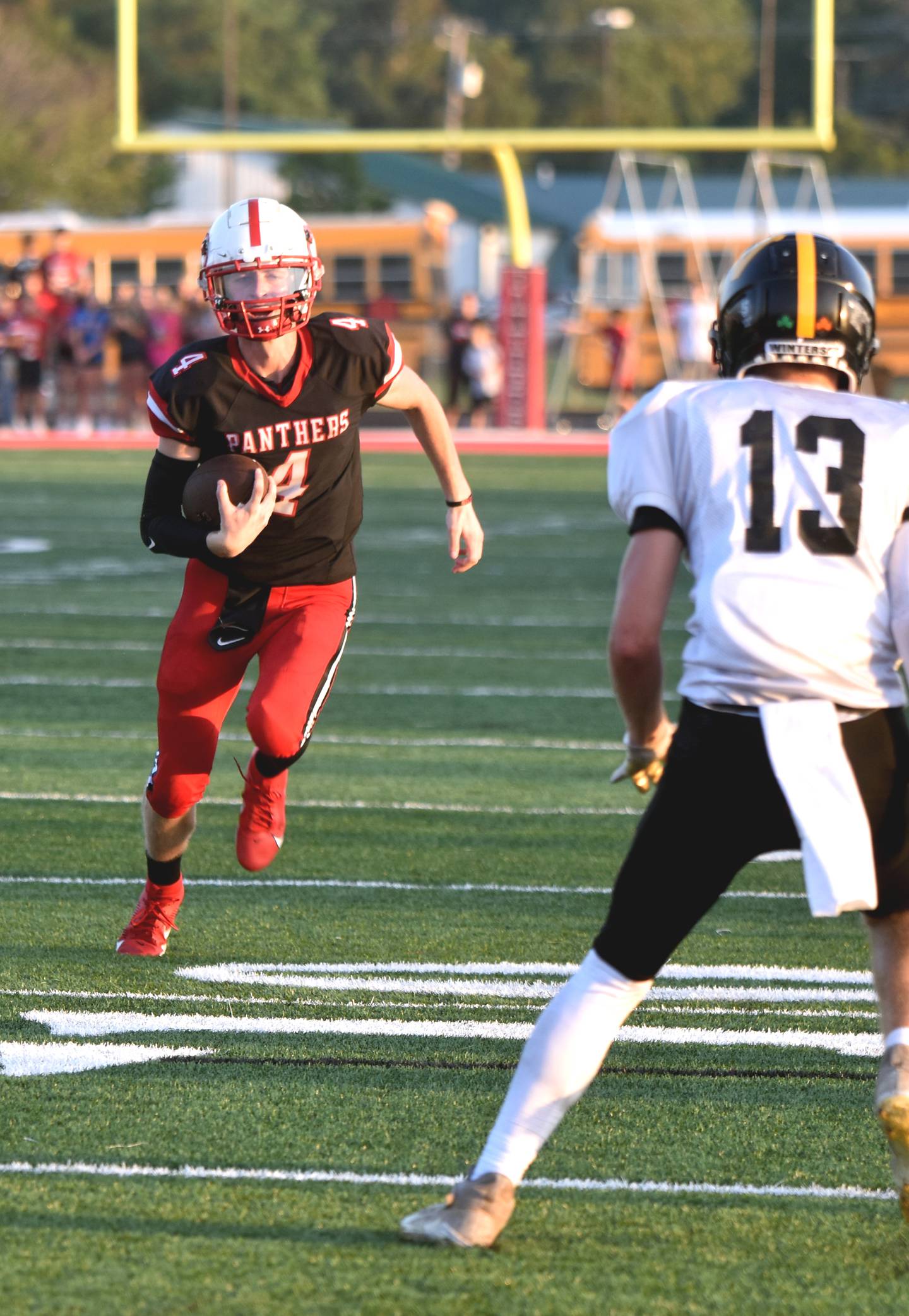 Senior Cael Turner takes off downfield on a quarterback keeper in the first quarter. Turner finished 20/26 for 206 yards and four touchdowns.