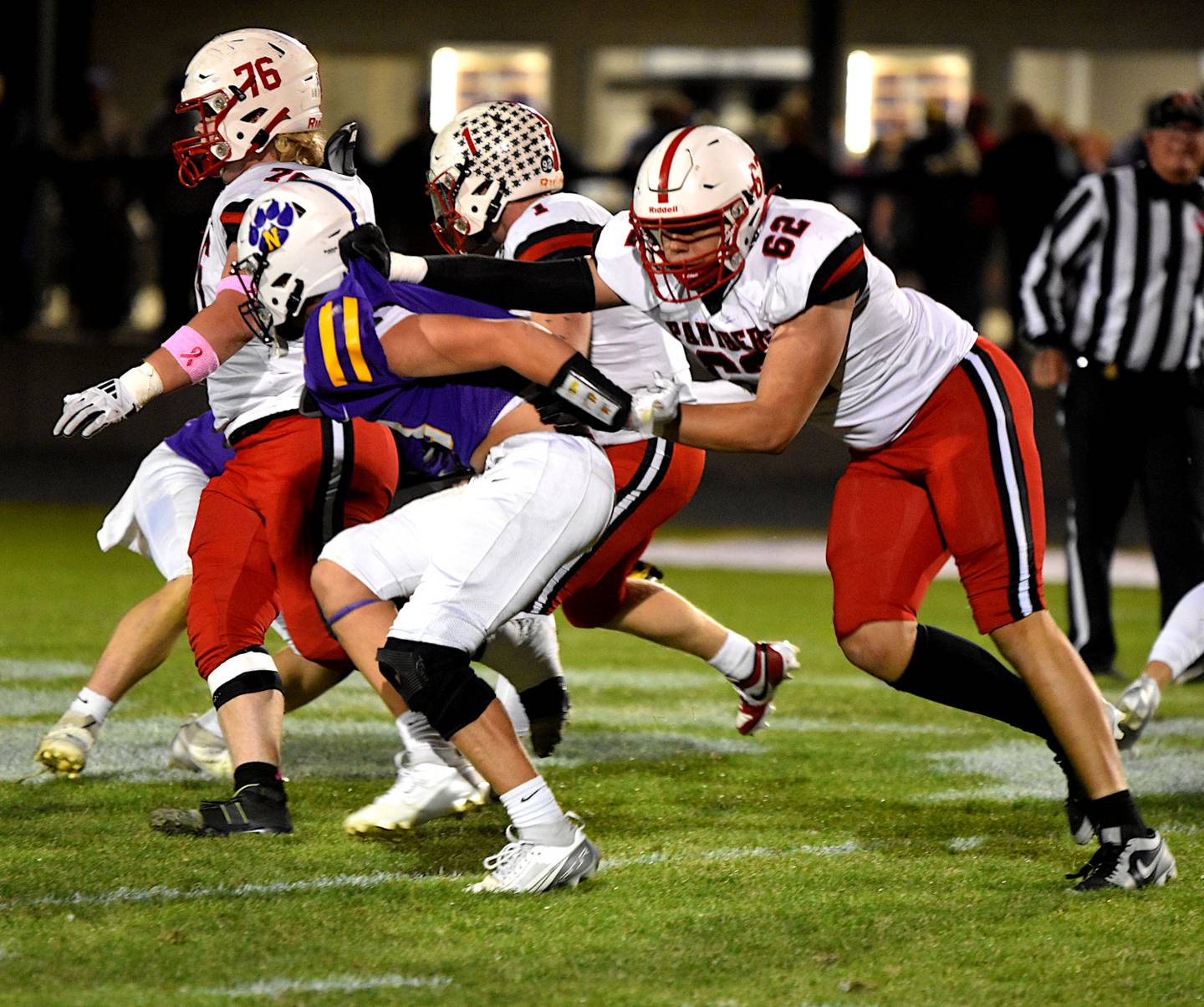 Creston offensive lineman Brayden Schoon keeps up with the Nevada defender Friday in Nevada's 49-28 win. Creston coach Brian Morrison said line play on both sides of the ball was heavily in Nevada's favor.
