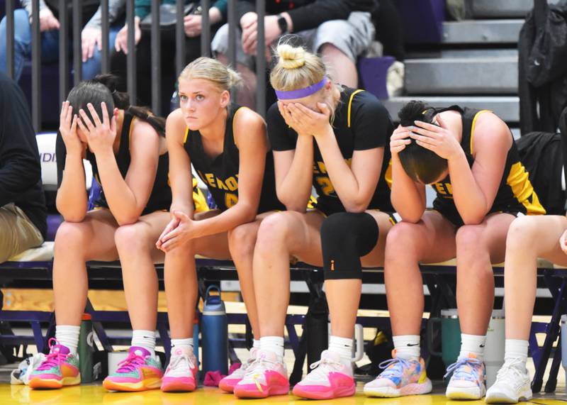 he four senior sit together on the bench after playing their last minutes of basketball as Tigers Wednesday in a 46-37 Region 6 finals loss to Montezuma. From left, Izzy Curtis, Zoey Reed, Sadie Cox and Bentley Petersen.