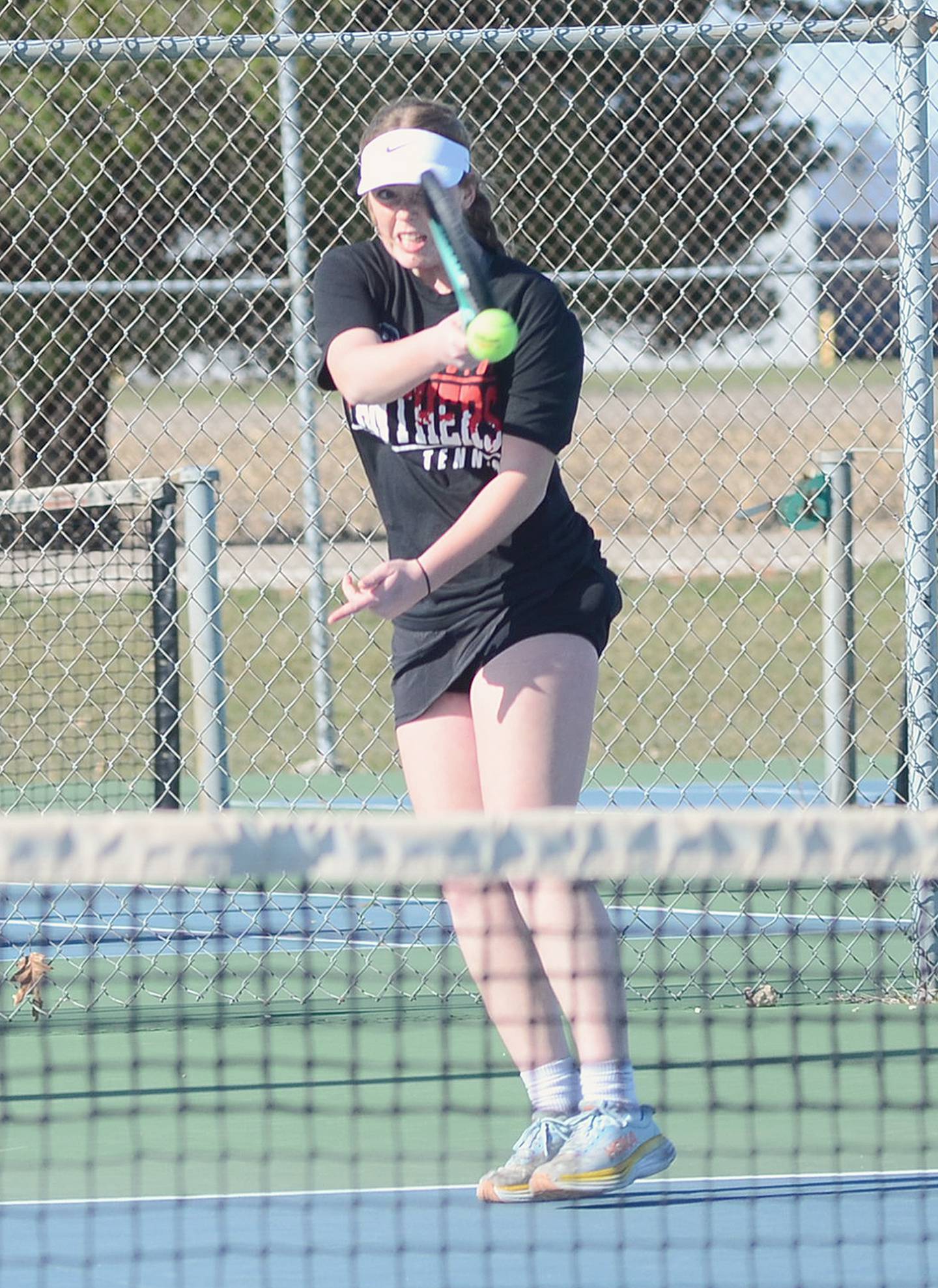 Creston freshman Violet Marcus hits a hard forehand shot during her 8-4 win over Deklyn Mullen of Southwest Valley in No. 5 singles Monday. Franklin and Josie Mahan also won the No. 2 doubles match.