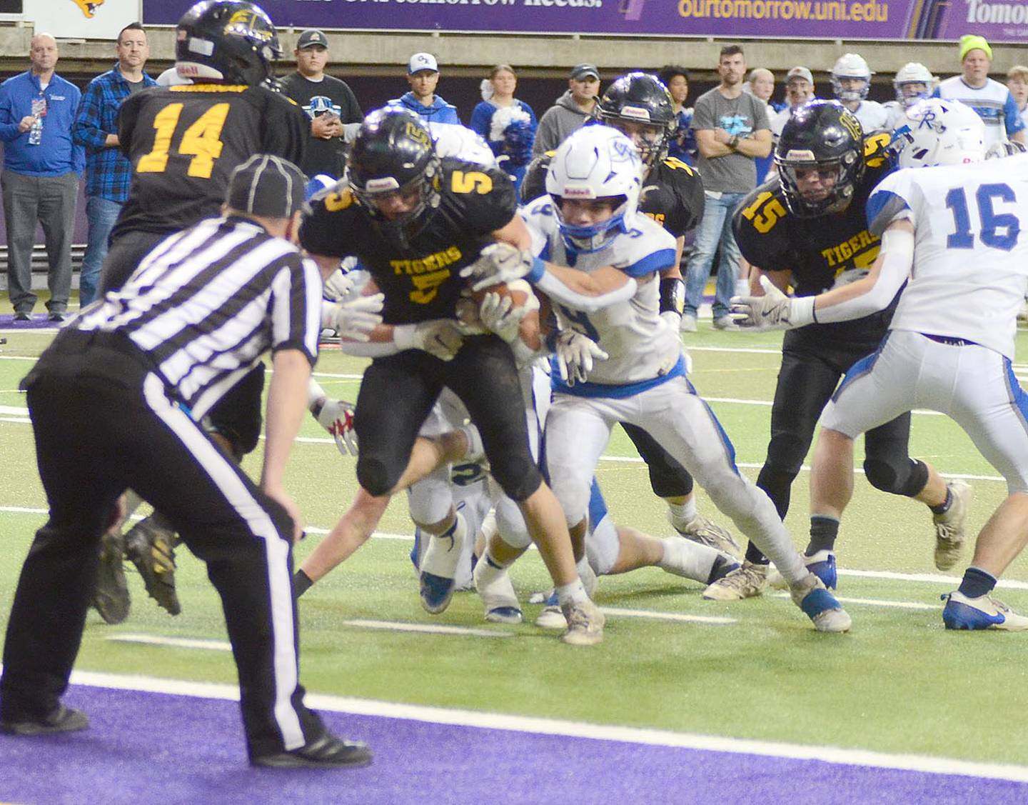 Kolben Robinson of Lenox (5) drags tacklers into the end zone for a 7-yard touchdown run in the first quarter against Gladbrook-Reinbeck Wednesday.