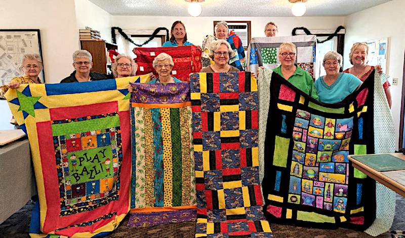 Members of the Patches and Pieces Quilt Guild show their work. The club celebrates 40 years this year.