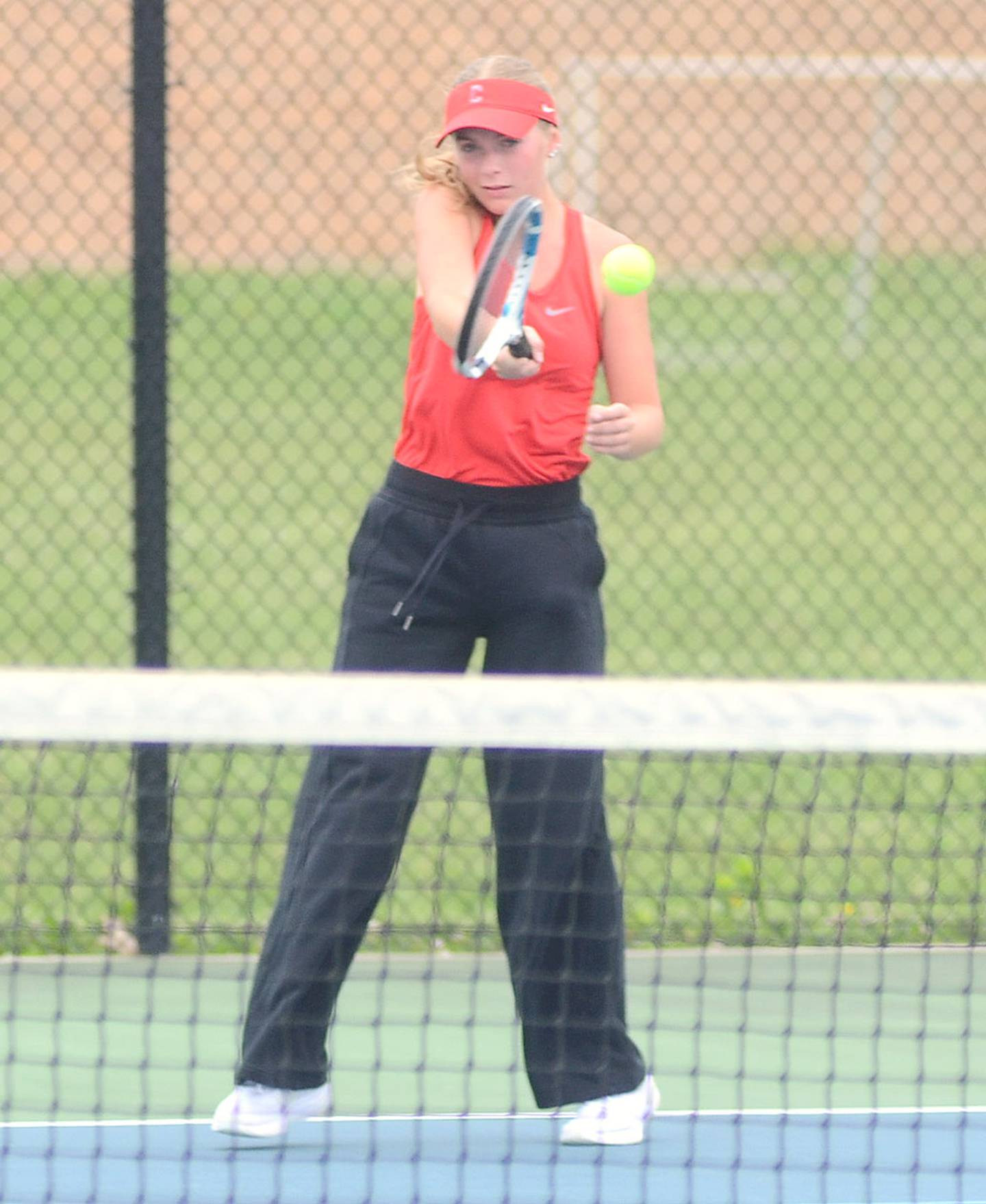 Creston senior Sasha Wurster completes a forehand return during her No. 2 singles match against Clarinda Tuesday.