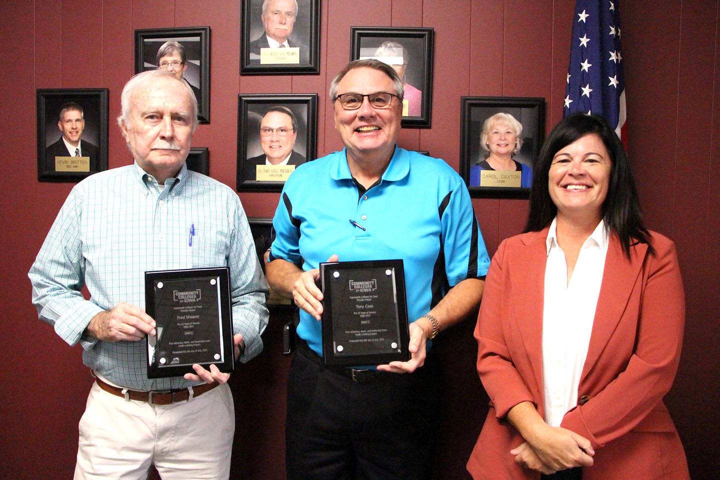 From left, SWCC Board Vice President Fred Shearer and President Tony Cass receive awards for years of service from SWCC President Lindsay Stoaks.