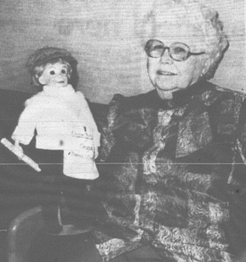 Leona Abbott of Creston displays her latest creation, a Creston News Advertiser carrier doll. Abbott has collected and made more than 1,000 dolls.