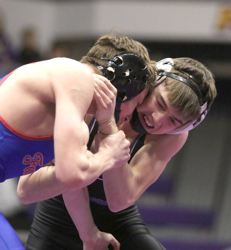 Wolverine senior Ty Strode goes in on a shot against West Sioux's Kash Koopman in the regional duals last Tuesday at Logan-Magnolia.