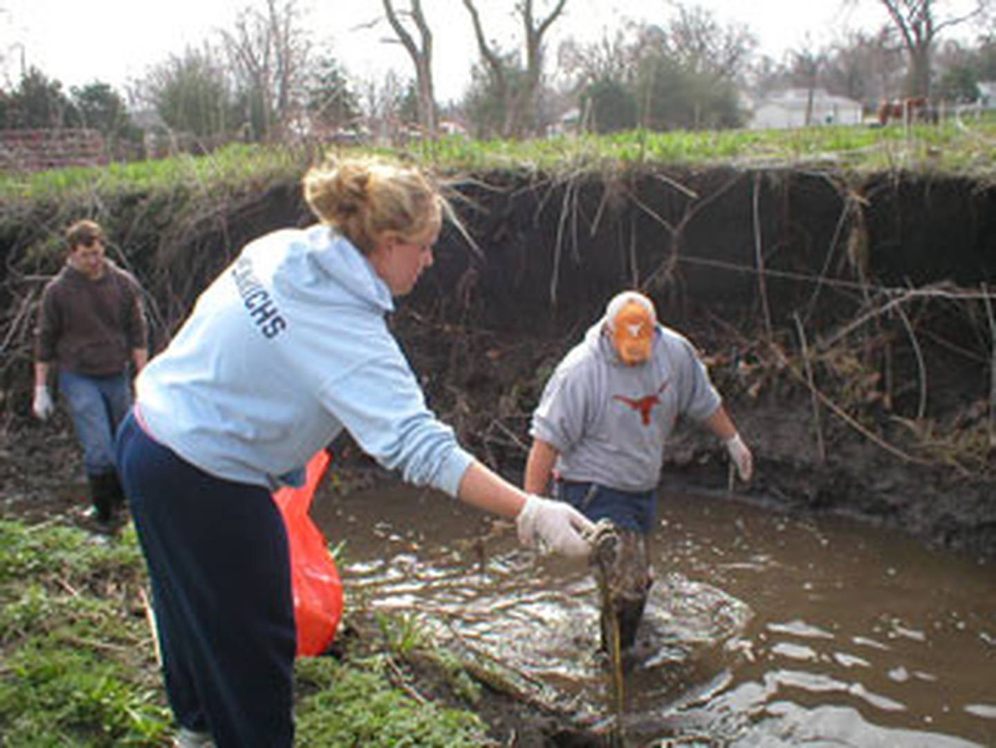 Volunteers work to clean Hurley Creek in May 2009.