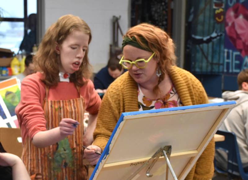 CHS Art teacher Bailey Fry-Schnormeier works with junior Kaylee Hoepker on her Art Nouveau piece for the student gallery.