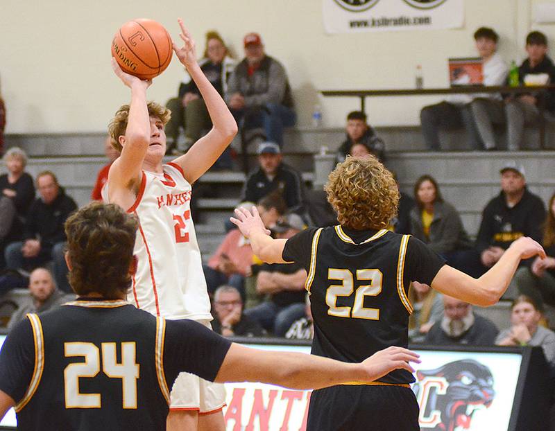 Baret Lane puts a shot up over Winterset defender Jackson Baer.