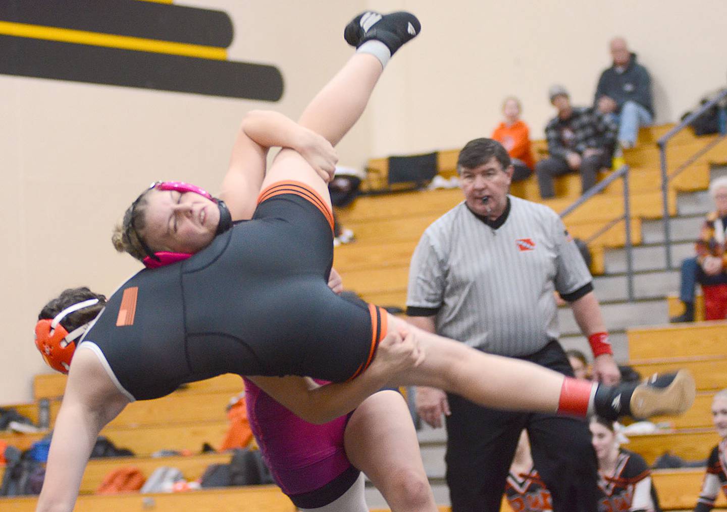 Evy Marlin of Highway 34 lifts Elaina Knipers of Red Oak before winning by a technical fall Thursday in Atlantic. Marlin also won the 130-pound weight class at Riverside on Friday.