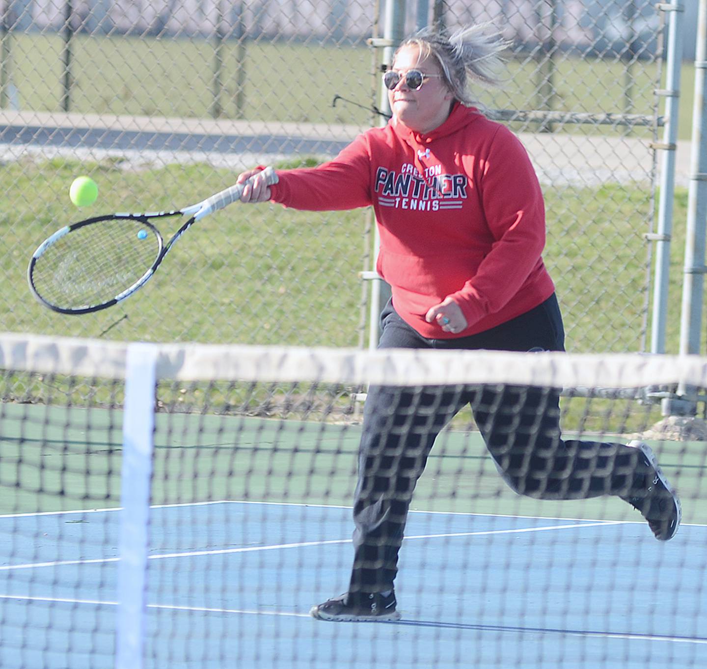 Creston's Abbie Wheeler reaches to return a shot near the net during her 9-7 singles win against Red Oak Thursday. Wheeler also teamed with Kolbey Bailey to win 9-8 on a tiebreaker at No. 3 doubles.