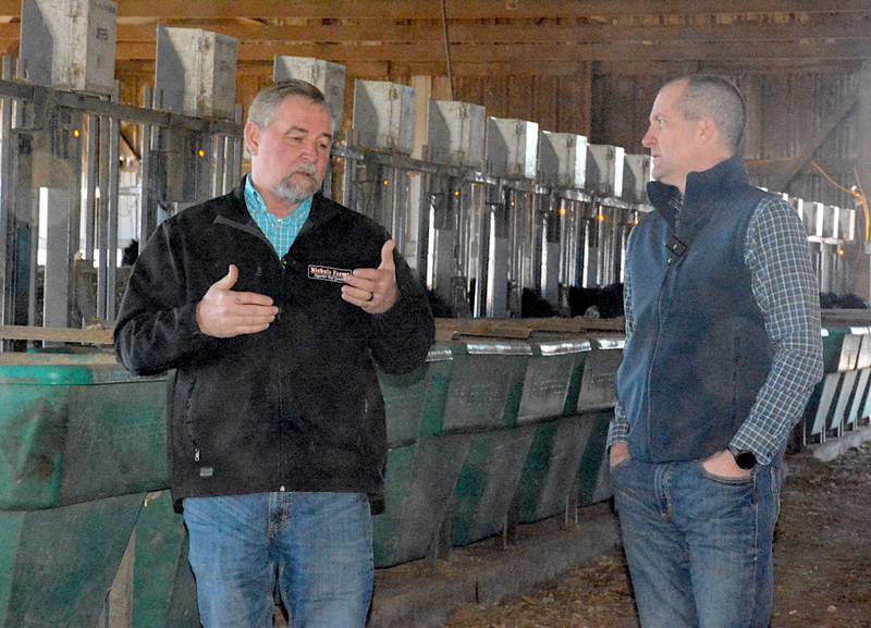 Nichols Farms' Ross Havens, left, explains the benefit of the feed efficiency system the farm uses to Secretary of Ag Mike Naig Friday.